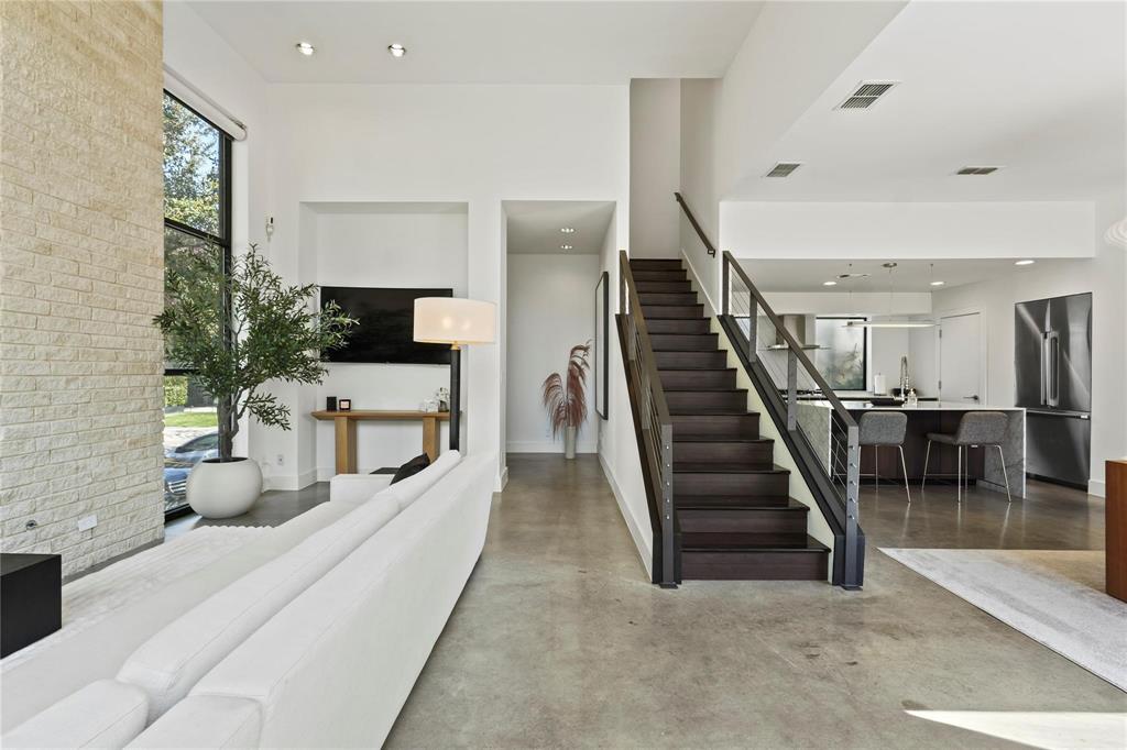 6 Vanguard Way Dallas, TX 75243 - Photo 7 of 35 a living room with furniture and stairs