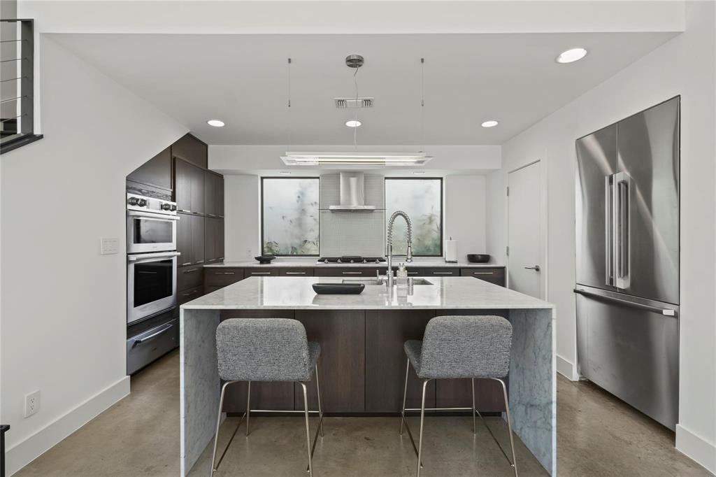 6 Vanguard Way Dallas, TX 75243 - Photo 10 of 35 a kitchen with refrigerator and chairs