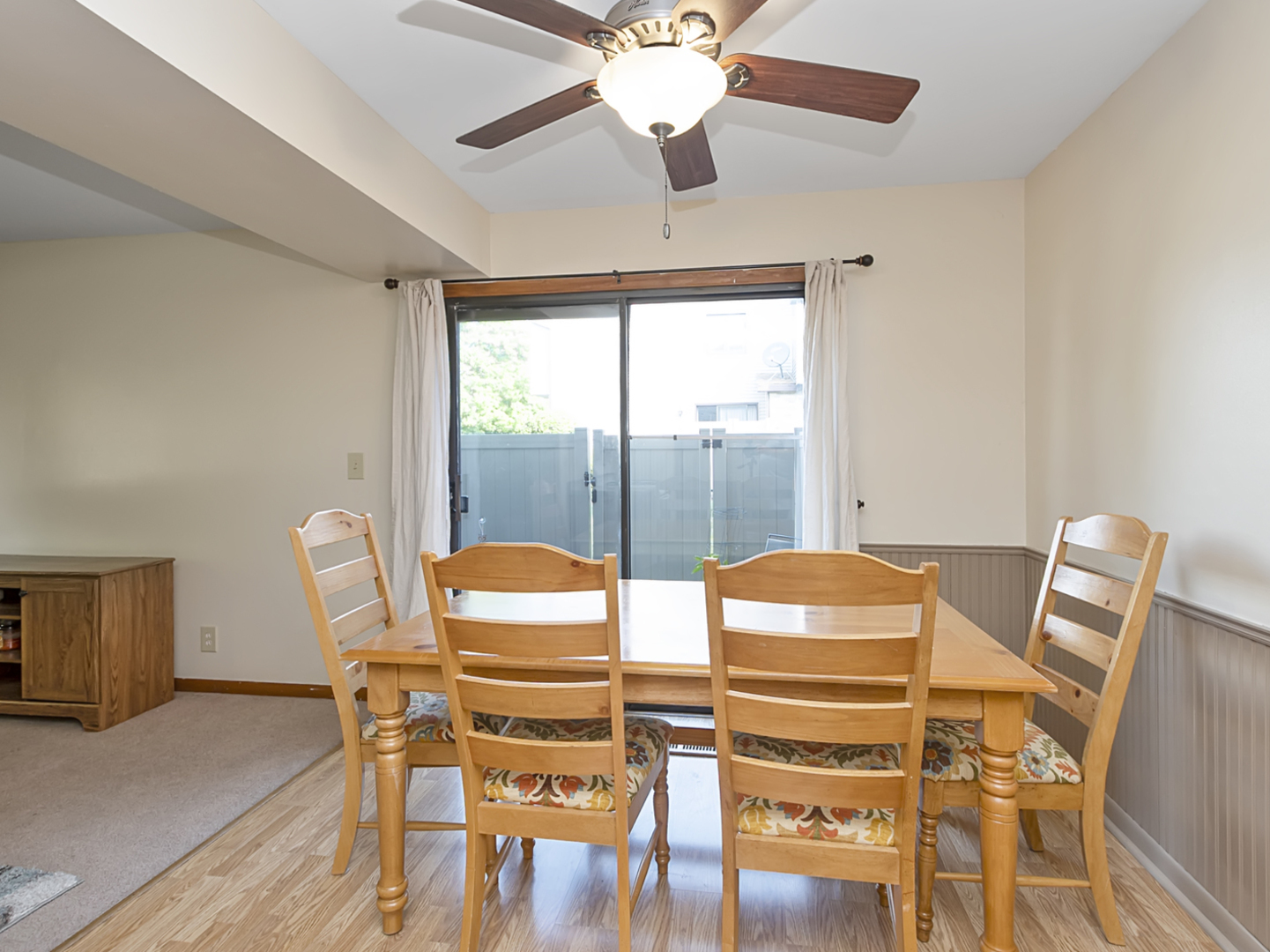 1032 Schoolgate Road New Lenox, IL 60451 - Photo 9 of 23 a view of a dining room with furniture wooden floor and chandelier
