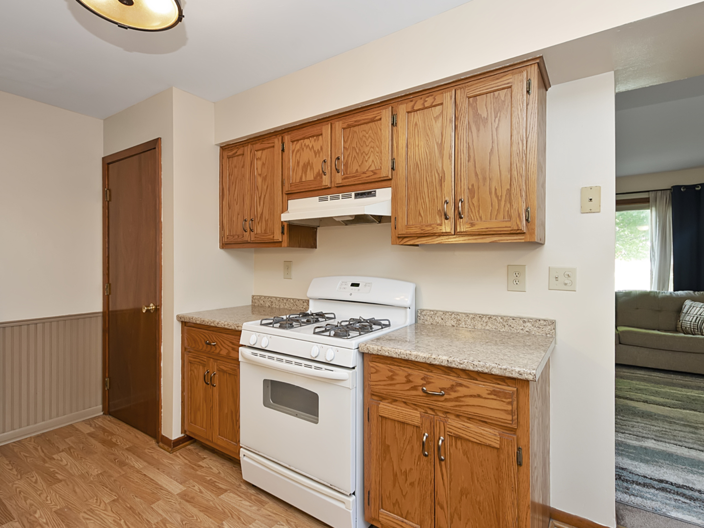 1032 Schoolgate Road New Lenox, IL 60451 - Photo 10 of 23 a kitchen with stainless steel appliances granite countertop a stove a sink and a microwave