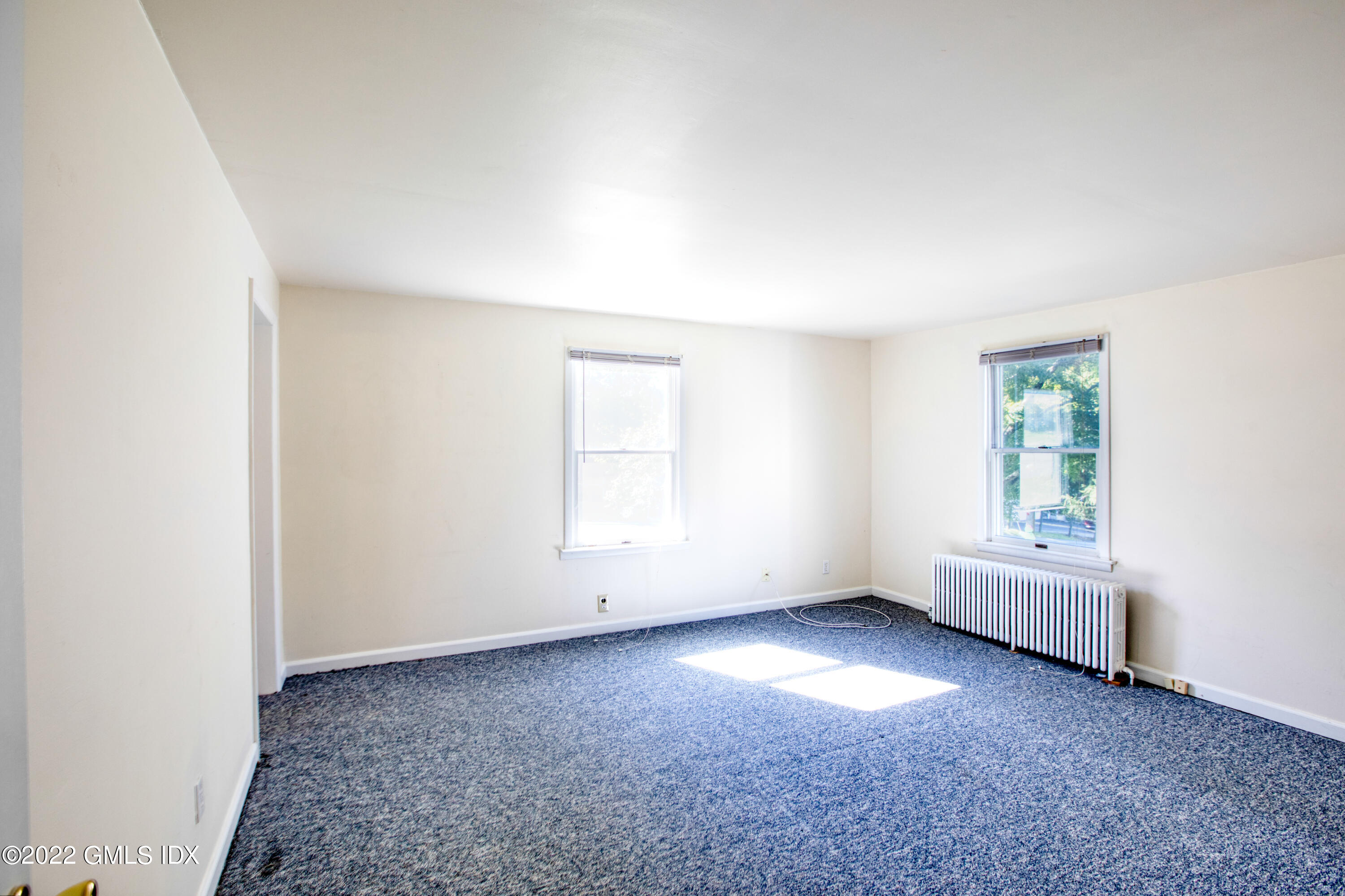 564 River Road Cos Cob, CT 06807 - Photo 18 of 24 an empty room with windows