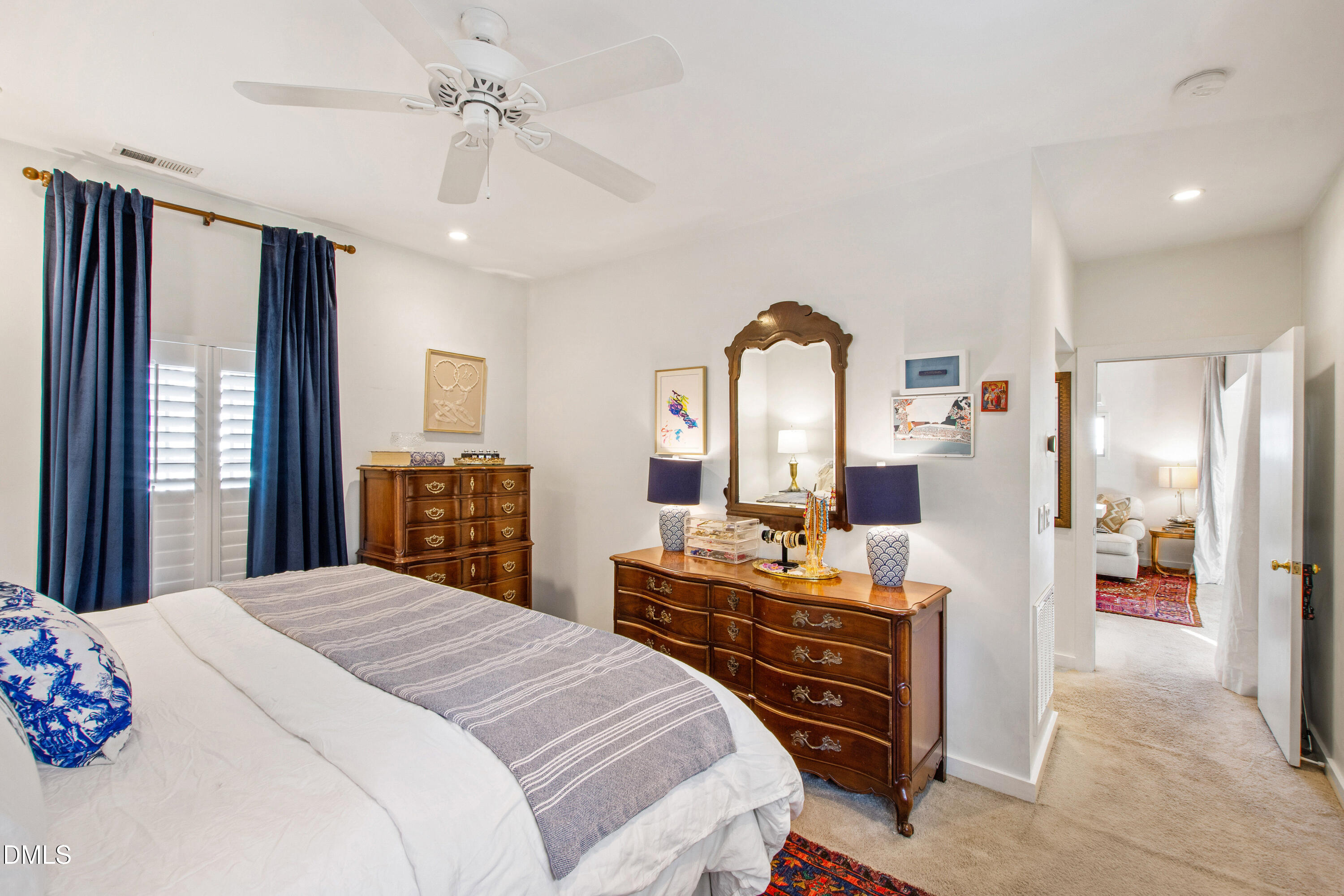 2803 Wayland Drive Raleigh, NC 27608 - Photo 23 of 40 a bedroom with a bed a flat screen tv and a large window