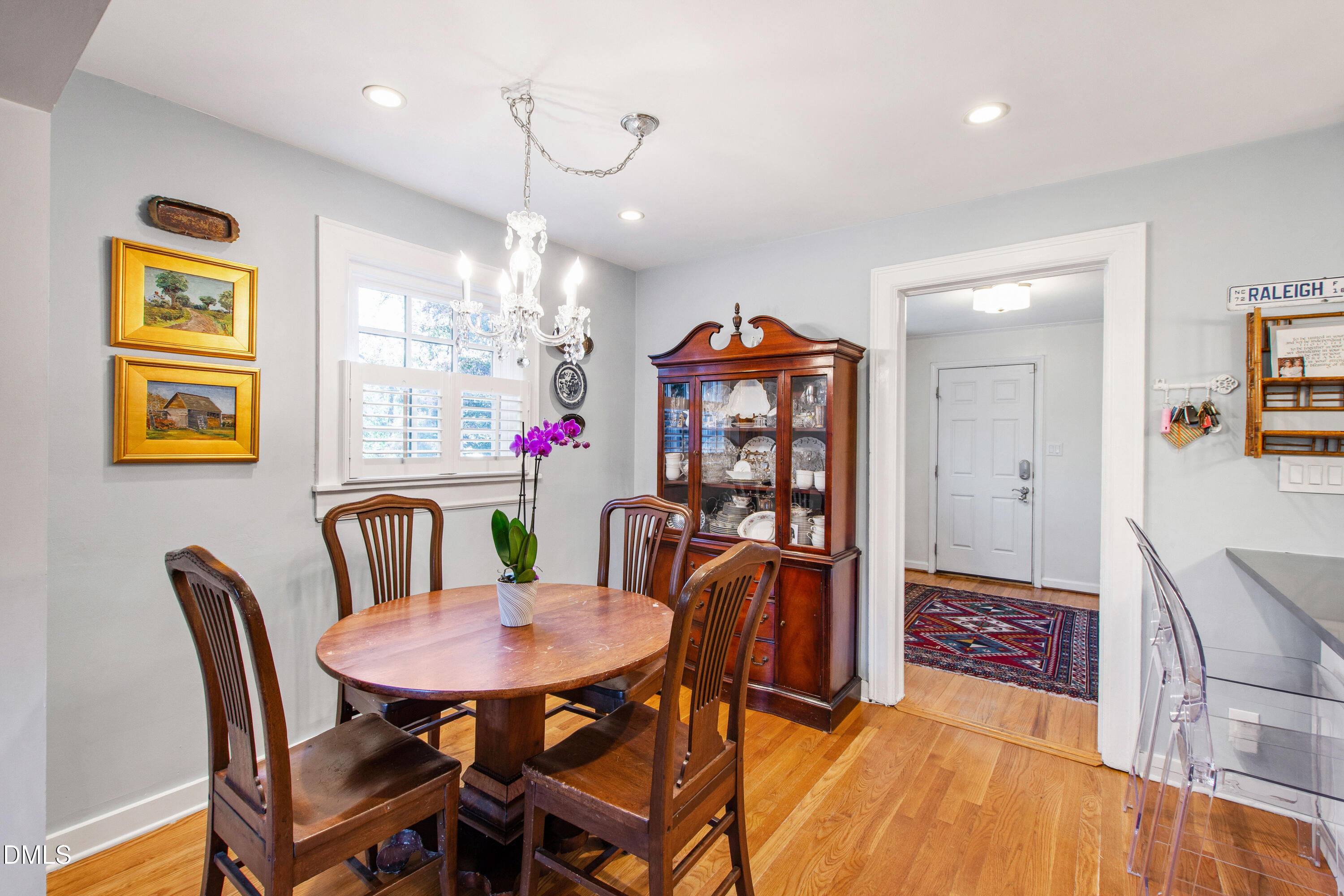 2803 Wayland Drive Raleigh, NC 27608 - Photo 8 of 40 a view of a dining room with furniture and chandelier