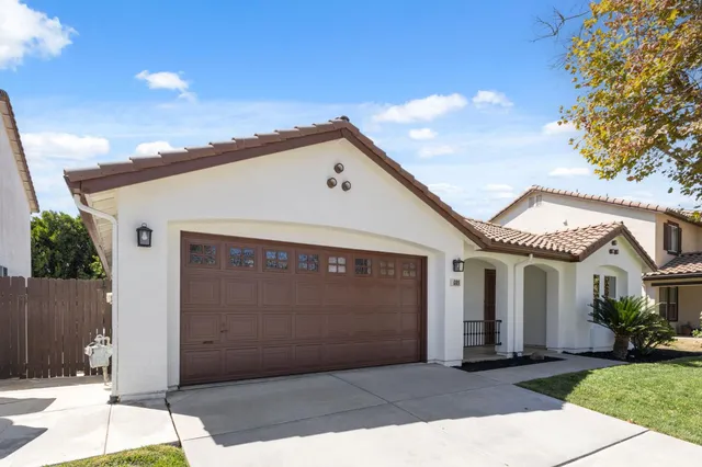 a front view of a house with a garage