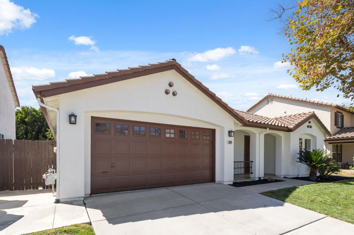 a front view of a house with a garage