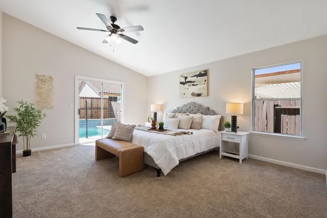 a bedroom with bed and a window