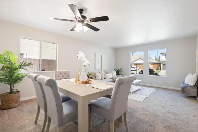 a dining room with furniture and window