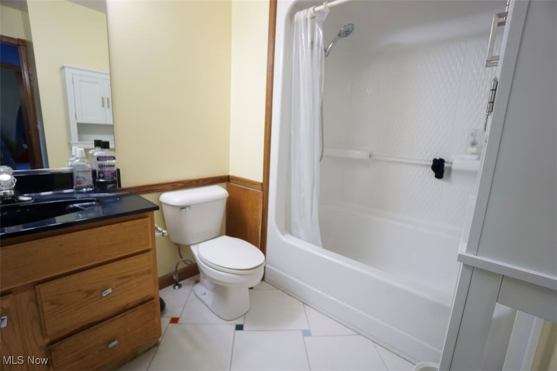 7060 Gates Road Gates Mills, OH 44040 - Photo 29 of 38 Bathroom with vanity, shower / tub combo, light tile patterned flooring.
