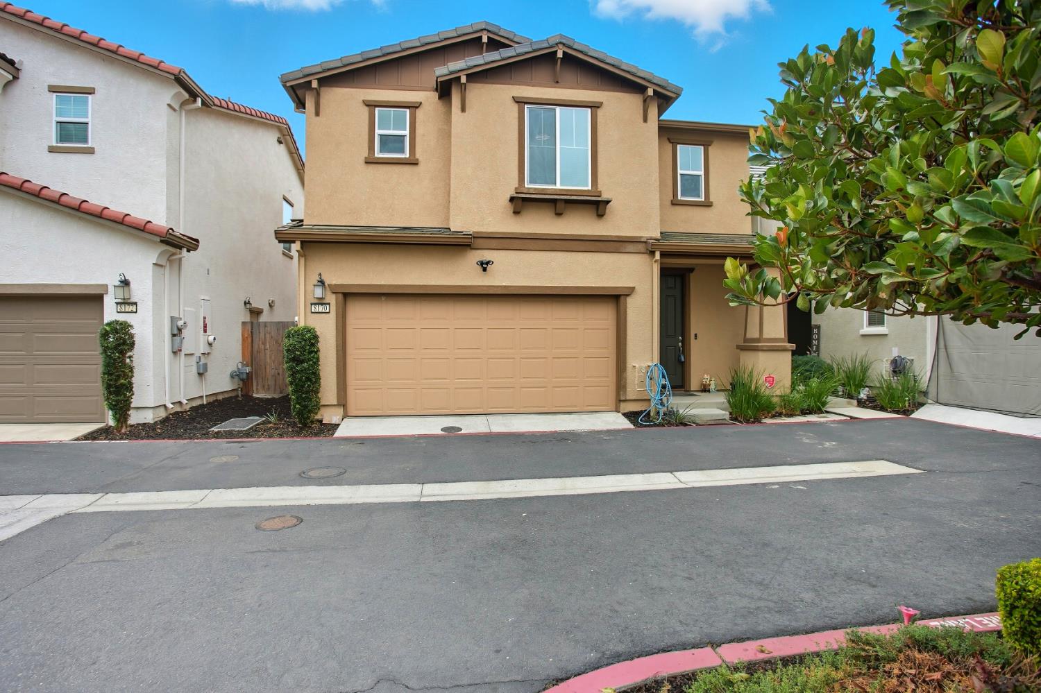 8170 Kramer Ranch Way Elk Grove, CA 95758 - Photo 1 of 1 a front view of a house with a yard and garage