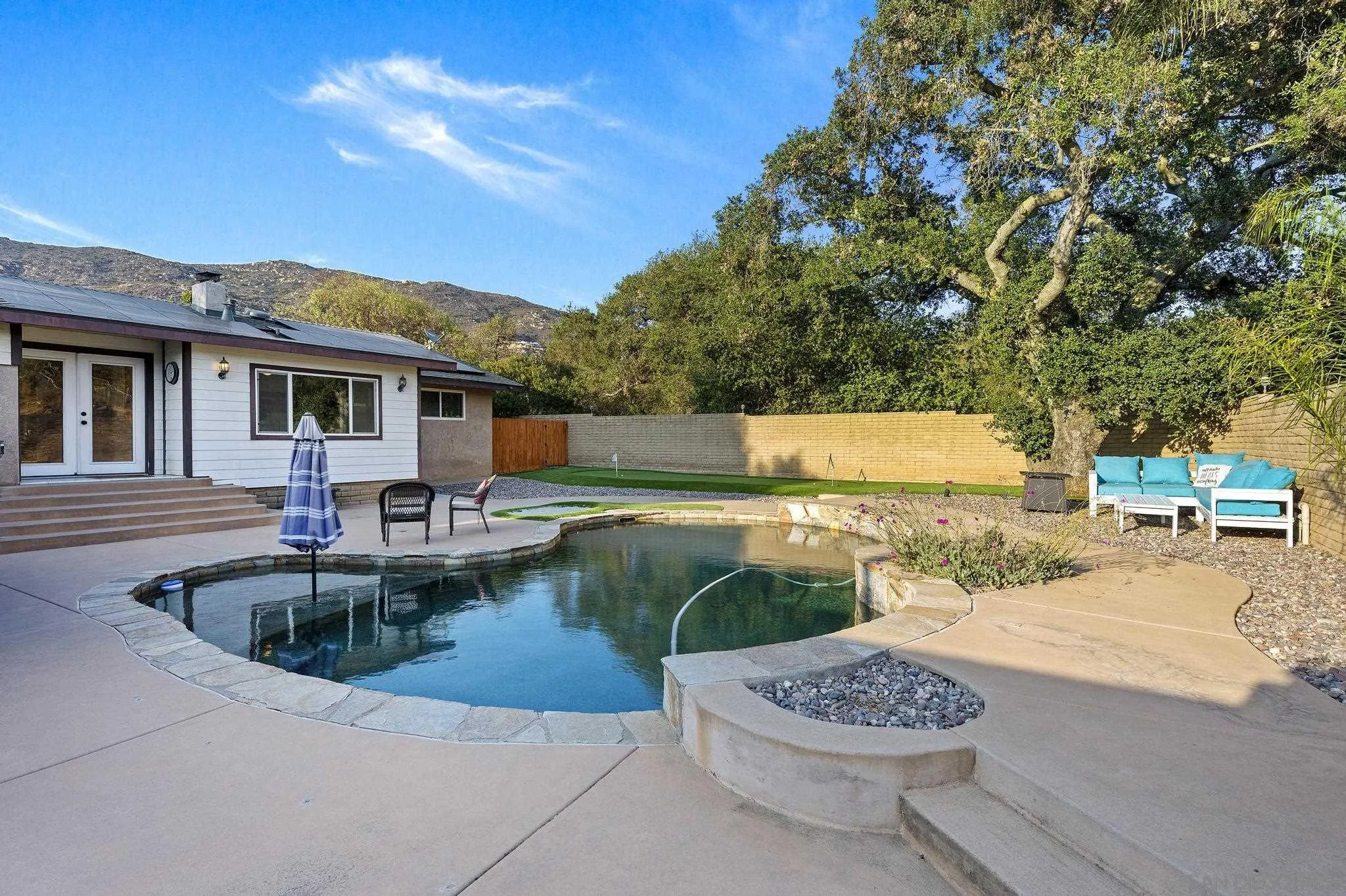 14725 Lyons Valley Road Jamul, CA 91935 - Photo 40 of 57 a view of a swimming pool with a patio