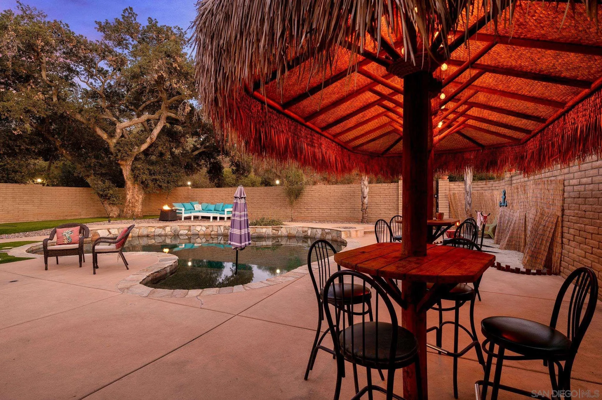 14725 Lyons Valley Road Jamul, CA 91935 - Photo 55 of 57 a patio with tables and chairs with a barbeque