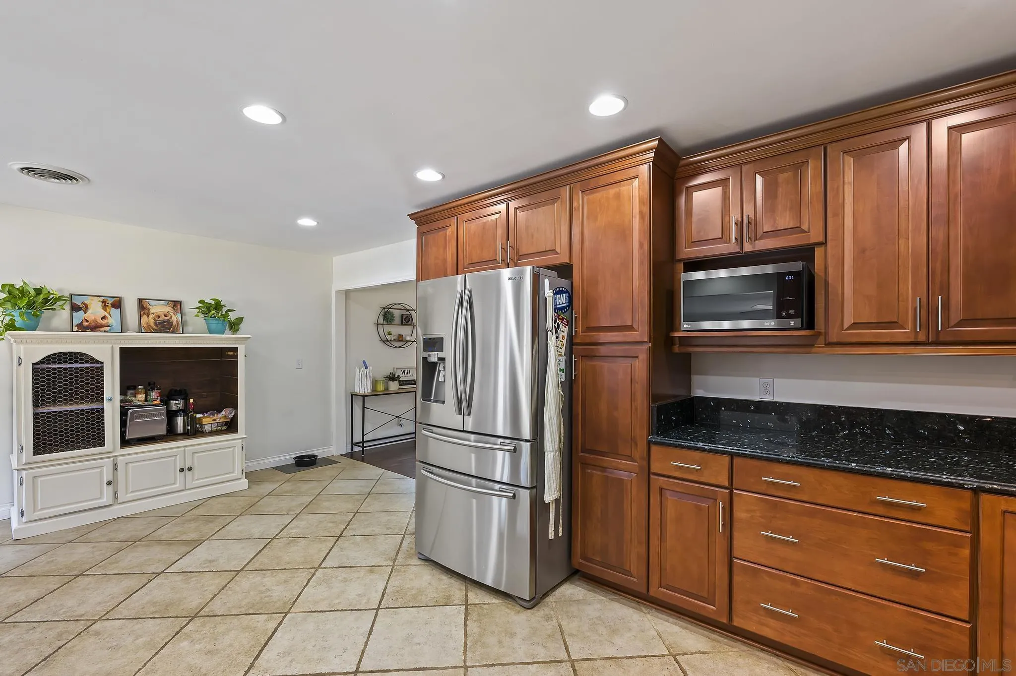 14725 Lyons Valley Road Jamul, CA 91935 - Photo 7 of 57 a kitchen with stainless steel appliances granite countertop a refrigerator and a stove top oven