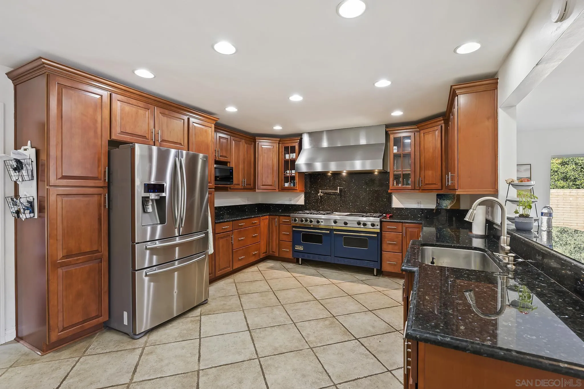 14725 Lyons Valley Road Jamul, CA 91935 - Photo 8 of 57 a kitchen with stainless steel appliances granite countertop a refrigerator sink and stove