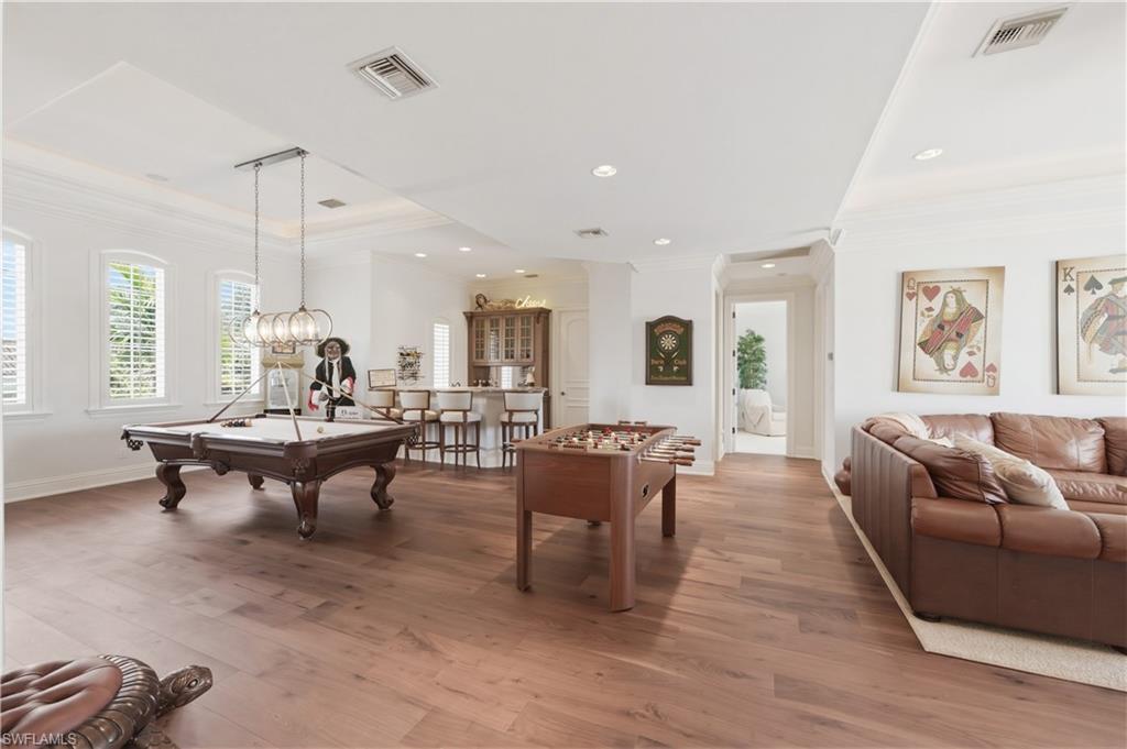 361 Pirates Bight Naples, FL 34103 - Photo 26 of 45 a living room with furniture a window and a table