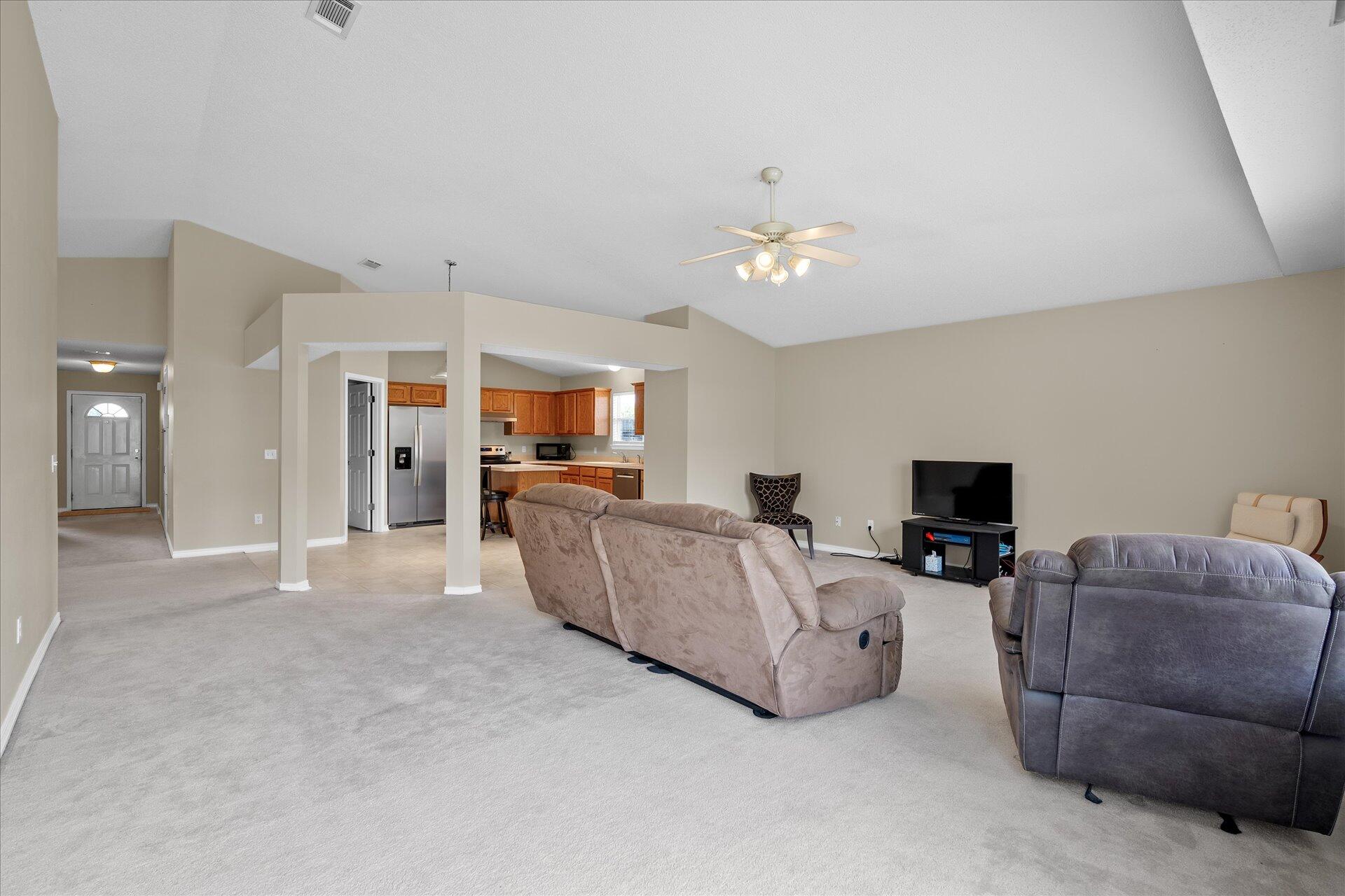 118 Sandstone Trail Crestview, FL 32539 - Photo 13 of 33 a living room with furniture and a flat screen tv
