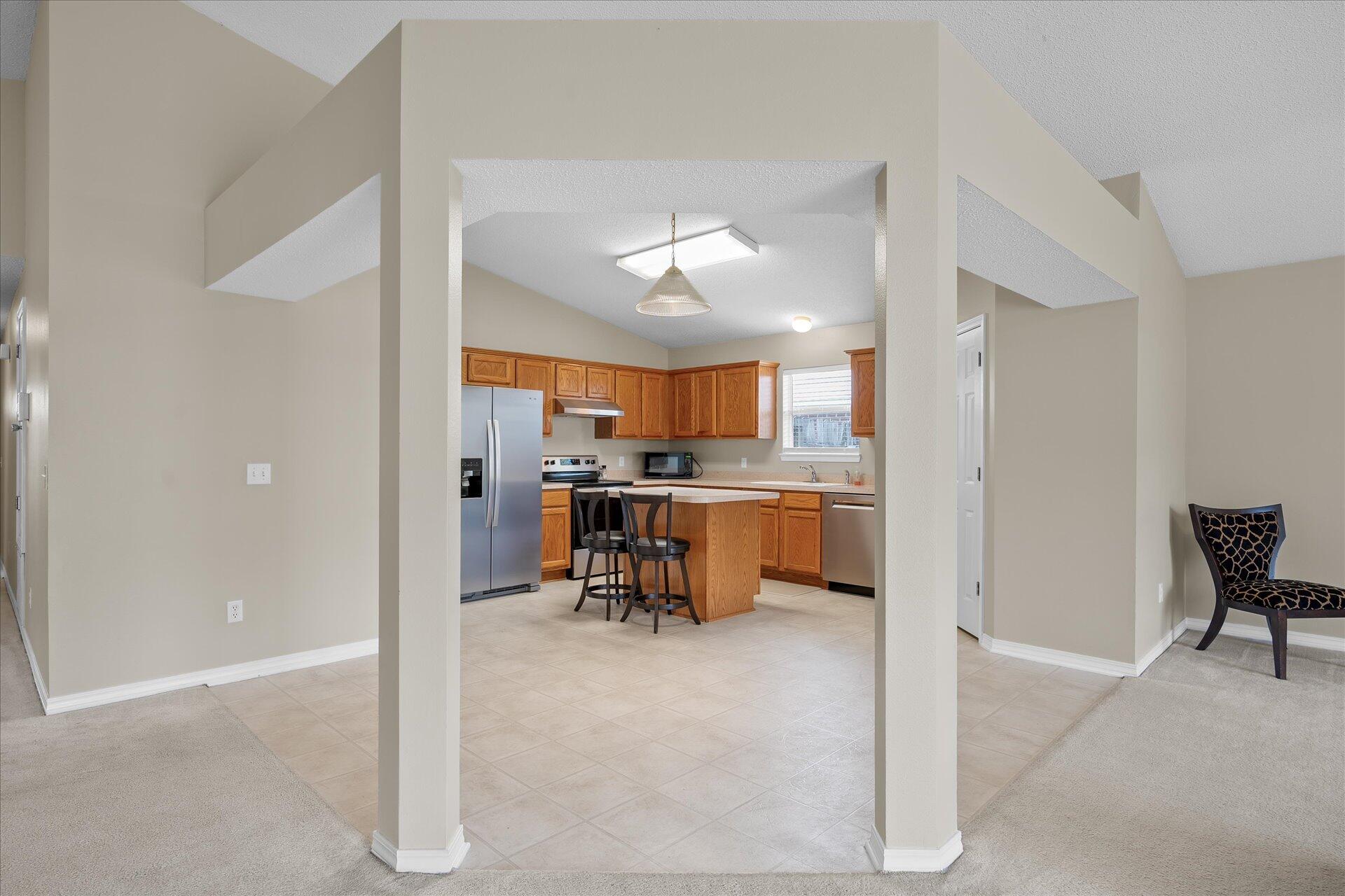 118 Sandstone Trail Crestview, FL 32539 - Photo 14 of 33 a view of kitchen with furniture and a refrigerator