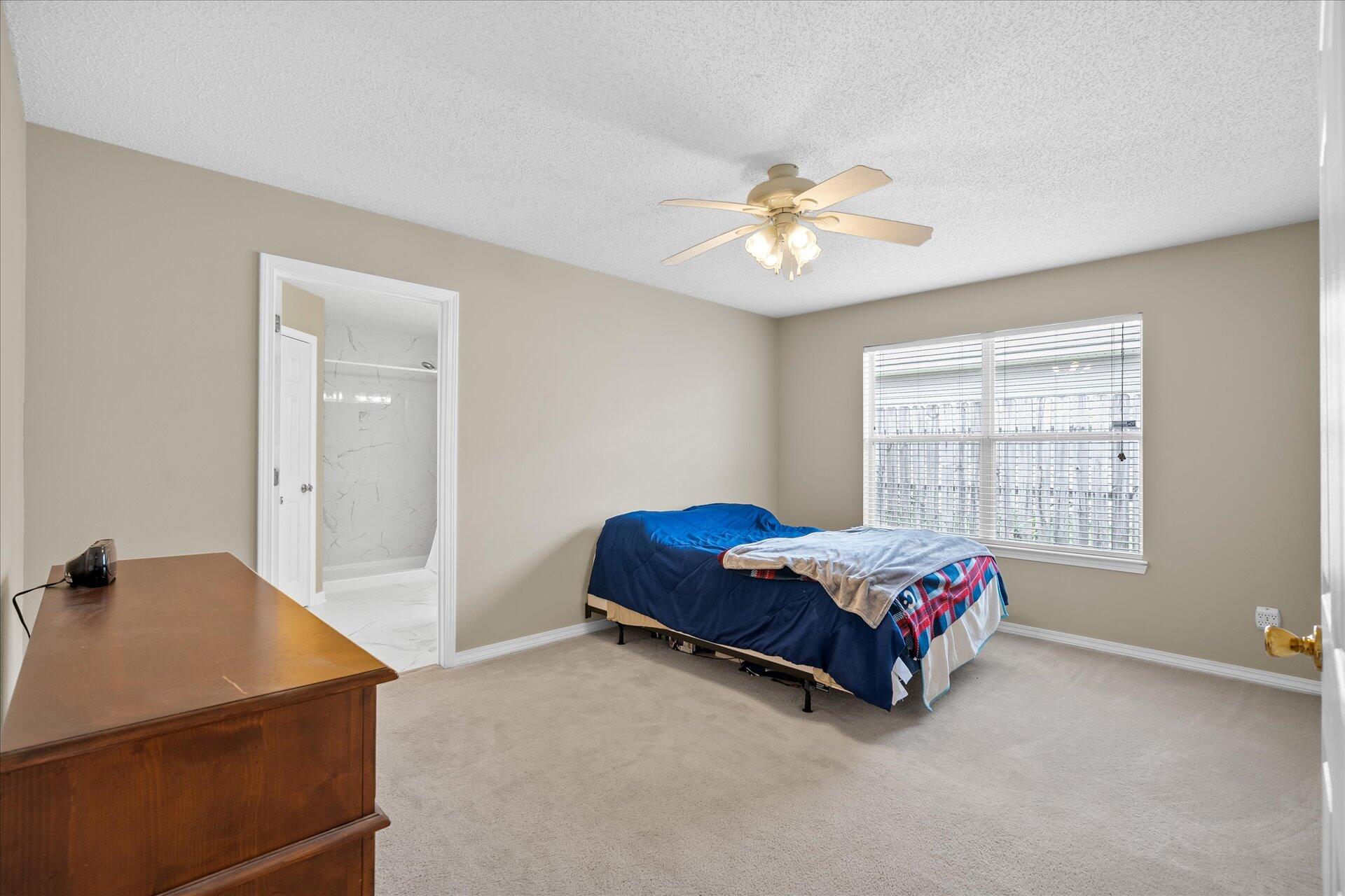 118 Sandstone Trail Crestview, FL 32539 - Photo 22 of 33 a room with a bed and a window