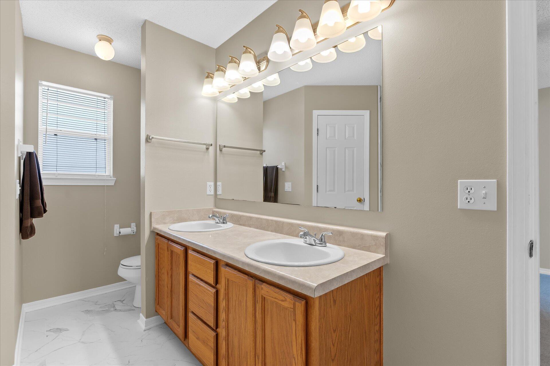 118 Sandstone Trail Crestview, FL 32539 - Photo 24 of 33 a bathroom with a sink a mirror and a shower