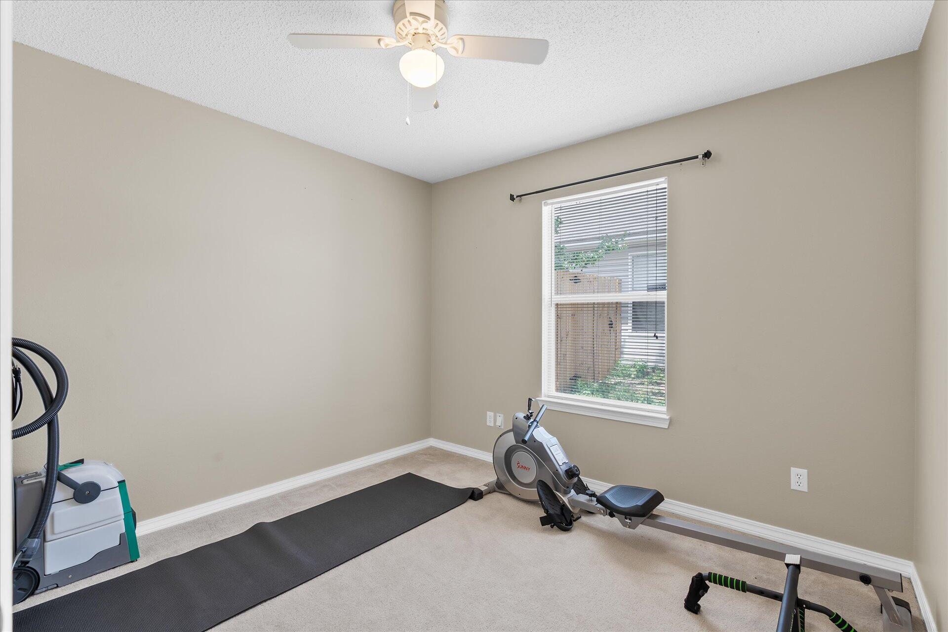 118 Sandstone Trail Crestview, FL 32539 - Photo 27 of 33 a view of a room with gym equipment