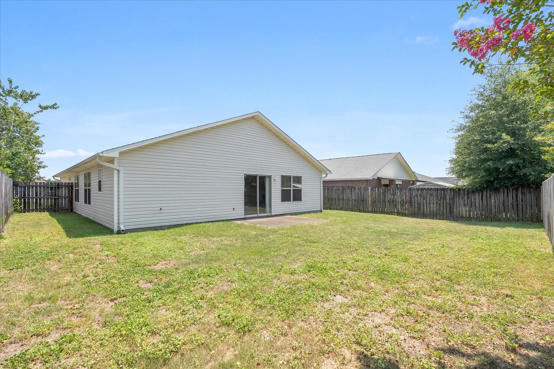 118 Sandstone Trail Crestview, FL 32539 - Photo 30 of 33 a view of a house with backyard and garden