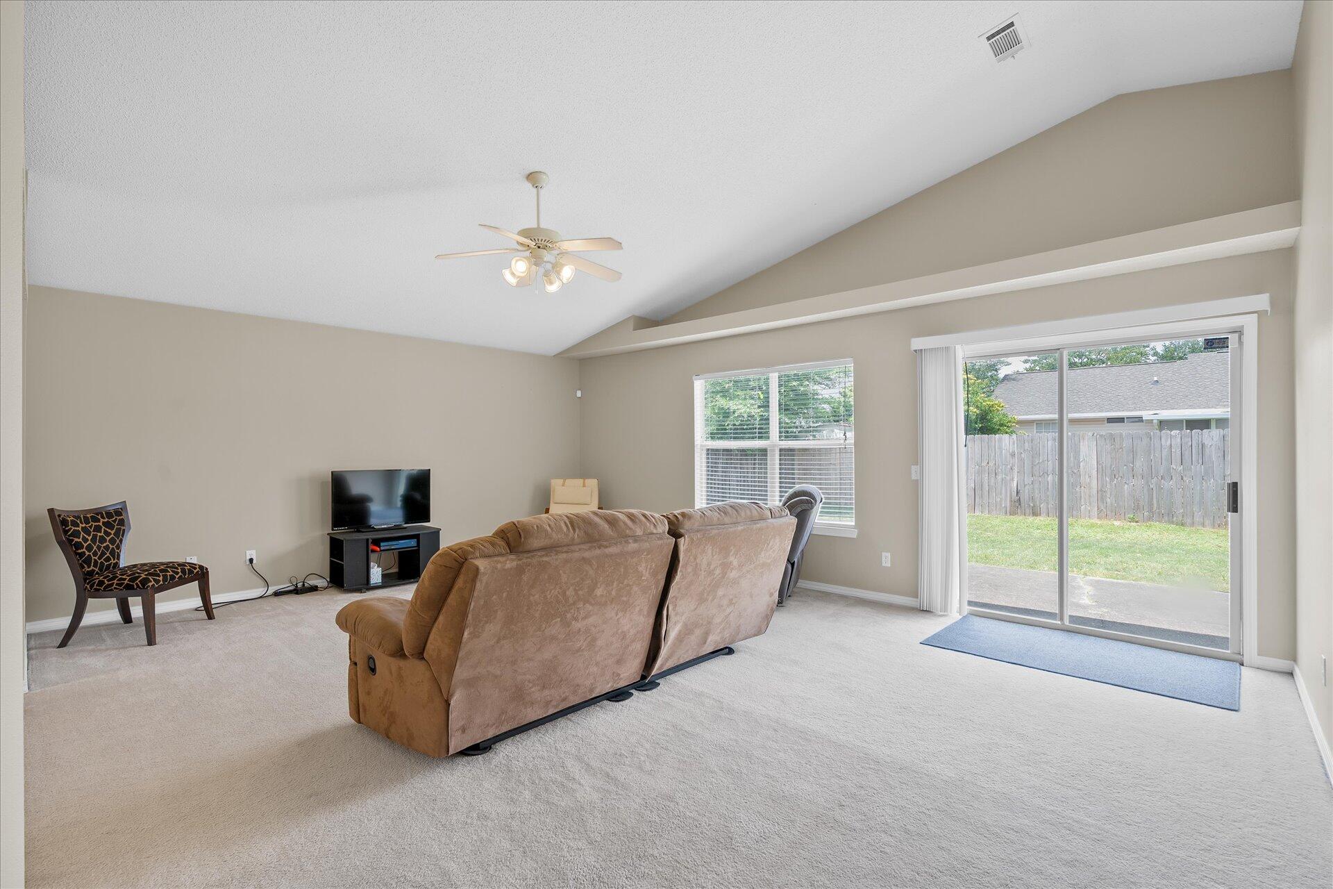118 Sandstone Trail Crestview, FL 32539 - Photo 10 of 33 a living room with furniture and a flat screen tv