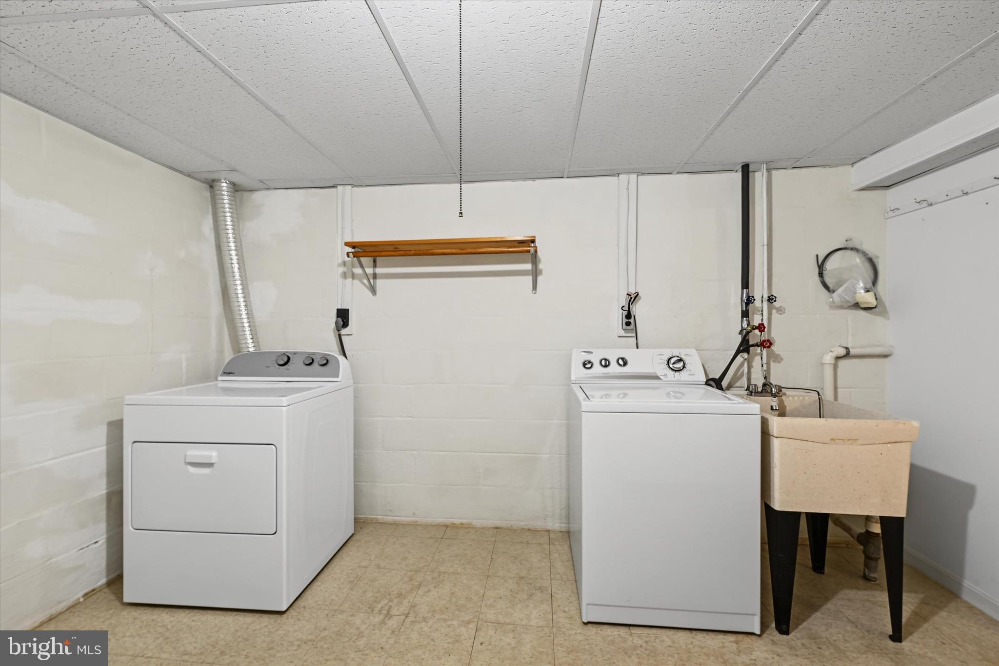 9939 Bird River Road Baltimore, MD 21220 - Photo 23 of 45 Laundry area w/washer, dryer and sink