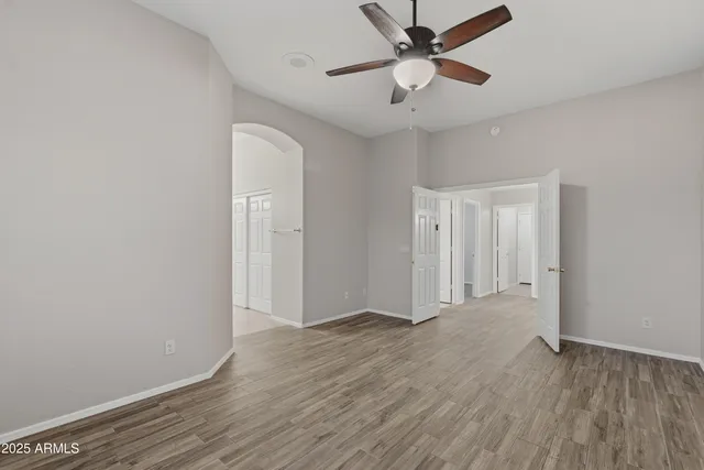 a bathroom with a double vanity sink toilet mirror and bathtub