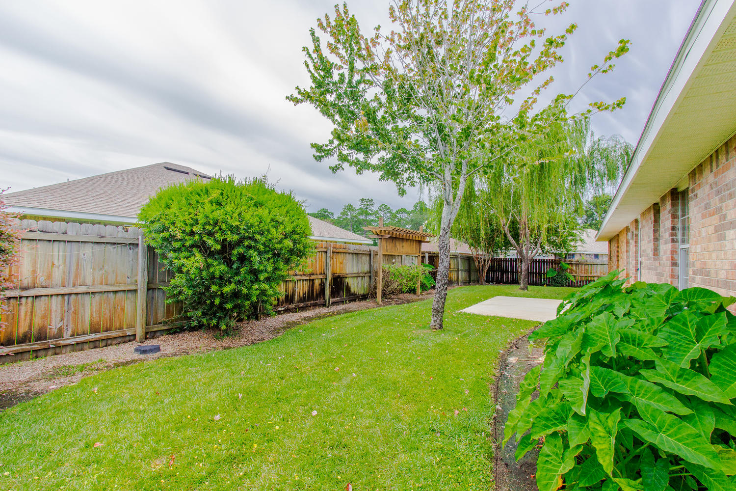 12 Inlet Drive Miramar Beach, FL 32550 - Photo 23 of 27 a view of a backyard with a garden and plants