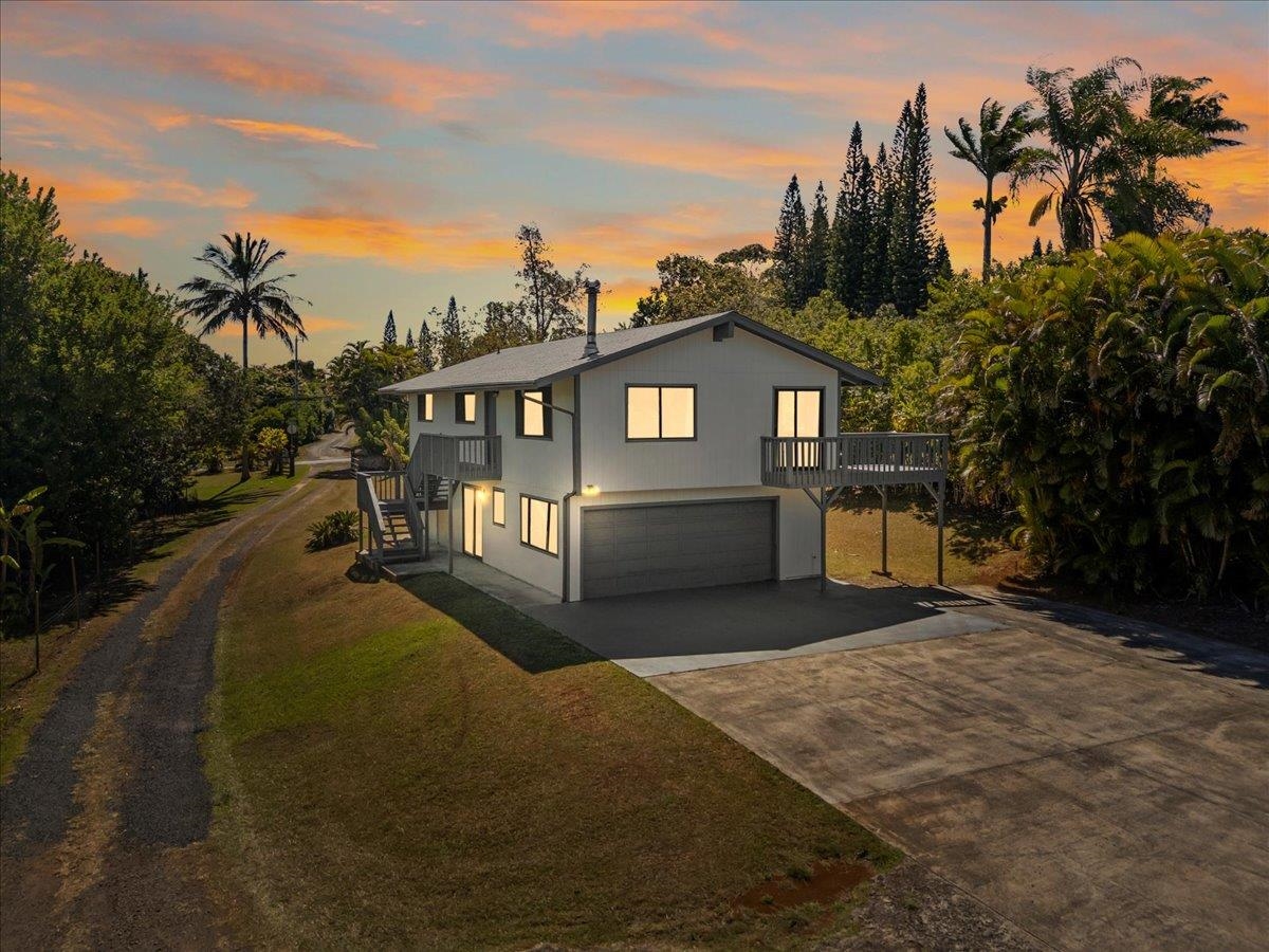 2130 Kauhikoa Road, Unit A Haiku, HI 96708 - Photo 2 of 43 a view of a house with backyard and porch