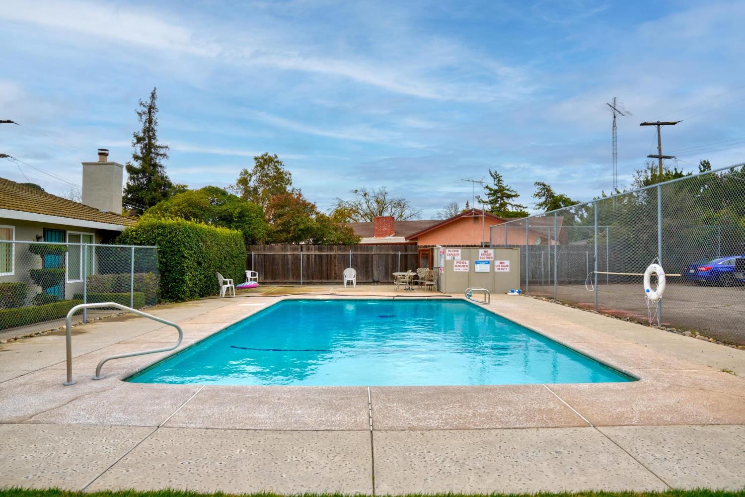 3025 Tully Road Modesto, CA 95350 - Photo 14 of 22 a view of a swimming pool with a lounge chairs