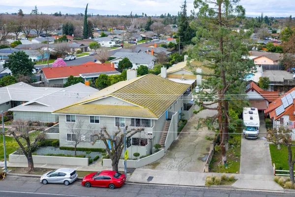 a view of a cars parked in front of a house