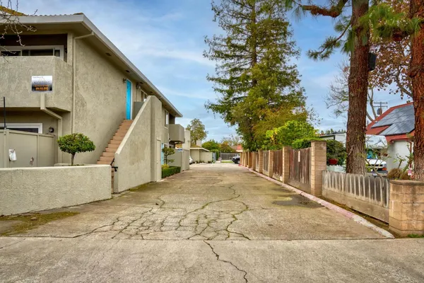 a view of a house with a small yard