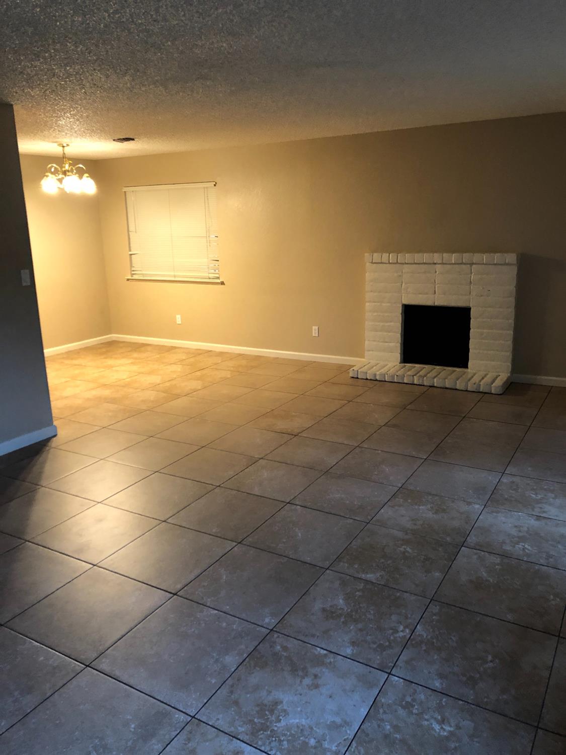 3025 Tully Road Modesto, CA 95350 - Photo 22 of 22 a view of empty room with a fireplace