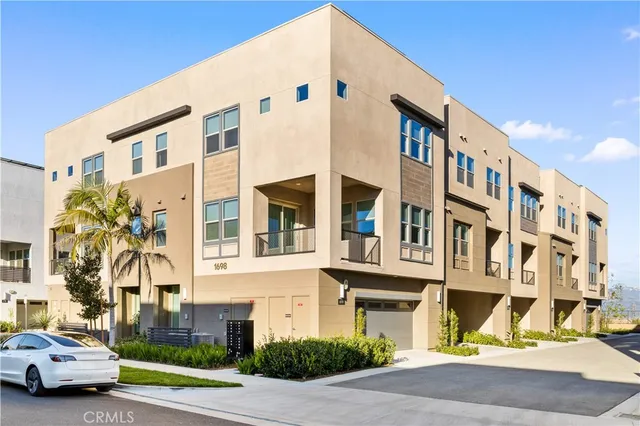 a couple of cars parked in front of a building