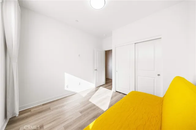 a view of a room with wooden floor