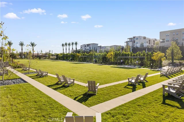 a view of swimming pool with outdoor seating and city view