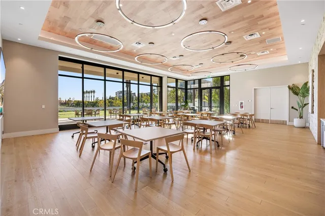 a view of a patio with table and chairs with wooden floor