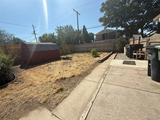 a view of a backyard of the house