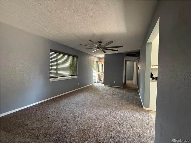 a view of empty room with windows