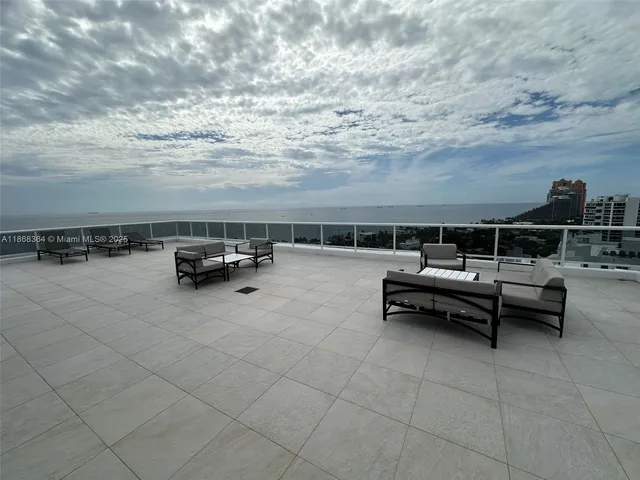 a roof view with outdoor seating