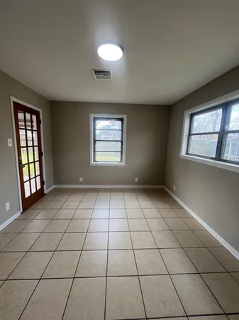 a view of an empty room and window