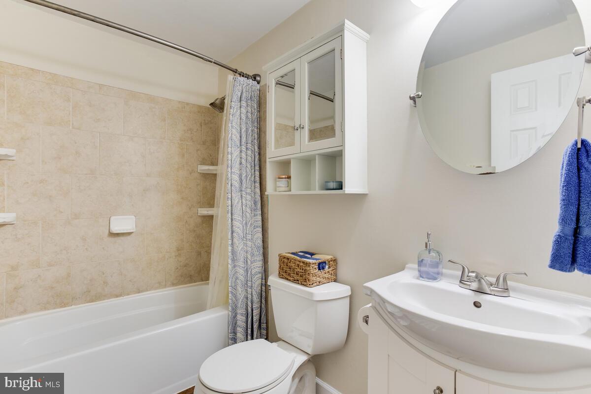 1260 Coster Road Lusby, MD 20657 - Photo 19 of 46 a bathroom with a sink toilet and shower
