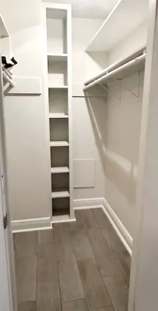 a view of an empty walk in closet