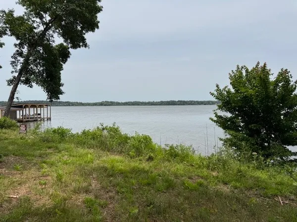 a view of a lake with beach in front of it