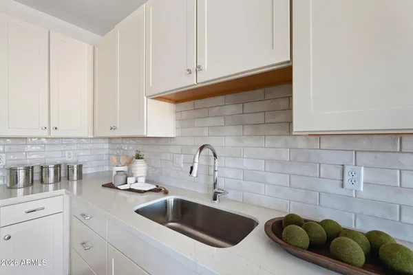 a kitchen with a sink and cabinets