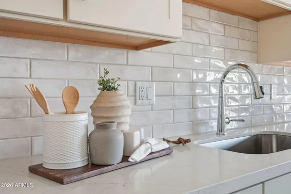 a bathroom with a sink and vanity