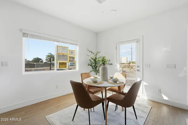 a dining room with furniture and window