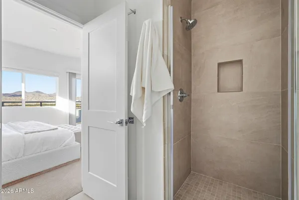 a bathroom with a granite countertop sink a toilet and a mirror