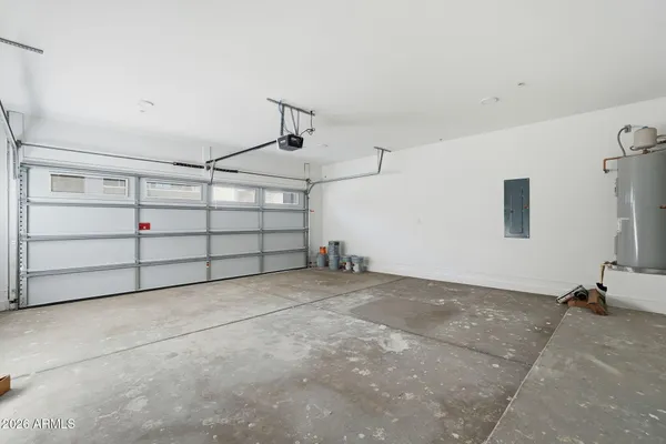 a view of a front door and wooden floor