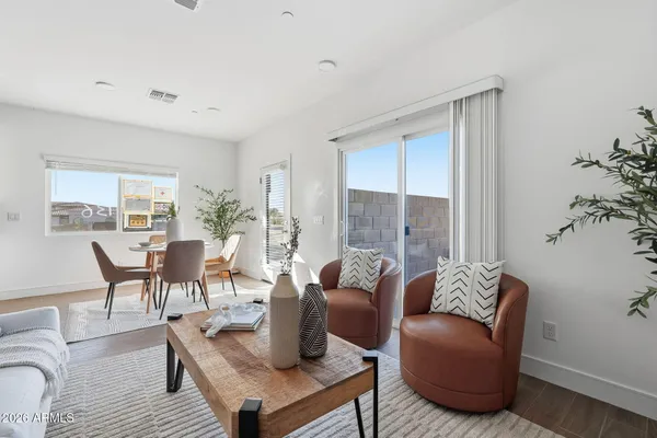 a living room with furniture and a large window